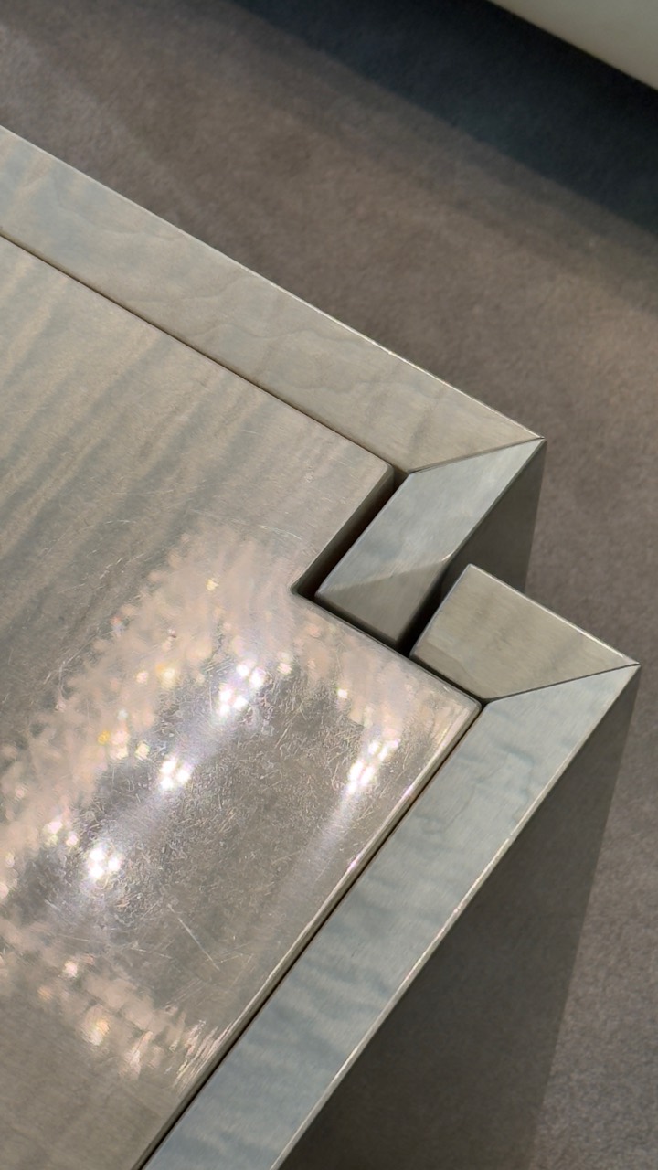 High-end furniture surface showing fine existing wear before protection in Vancouver