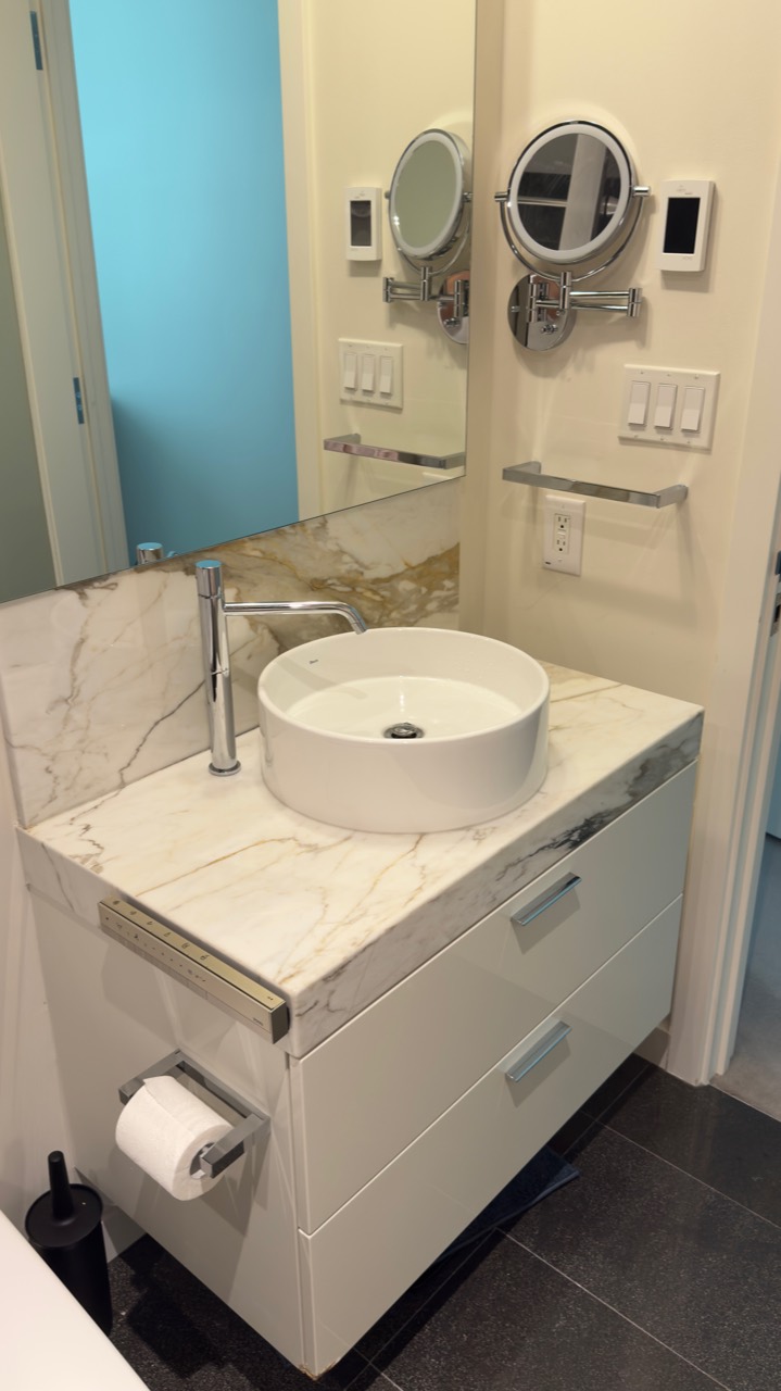 Completed stone bathroom vanity with polished surface protection in Vancouver