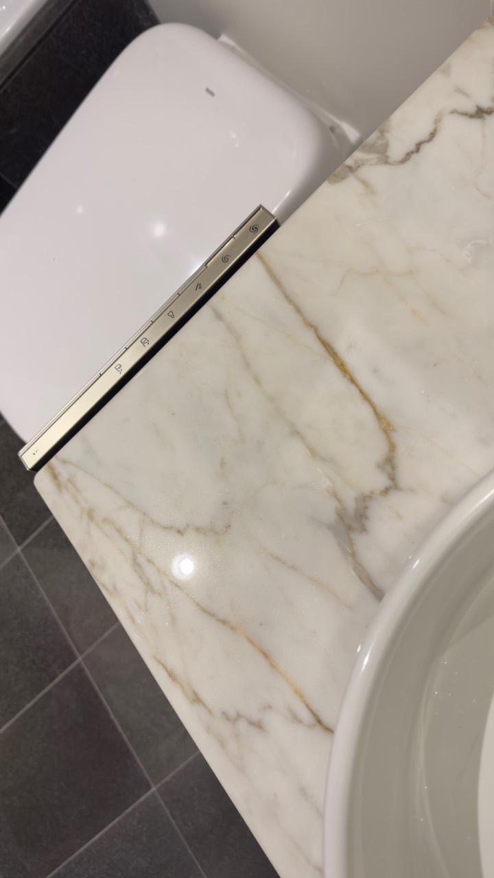 Stone bathroom vanity after polished Surface ProGuard countertop protection installation
