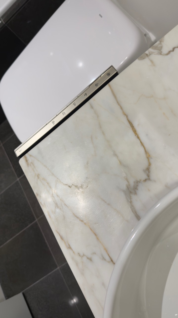 Stone bathroom vanity before countertop protection installation in Coal Harbour, Vancouver